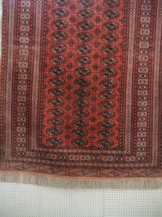 A Bokhara carpet with 48 octagons to the centre within multi-row borders 70" x 49"