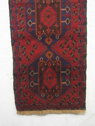 A contemporary blue and red ground Herrati rug, 77" x 42"
