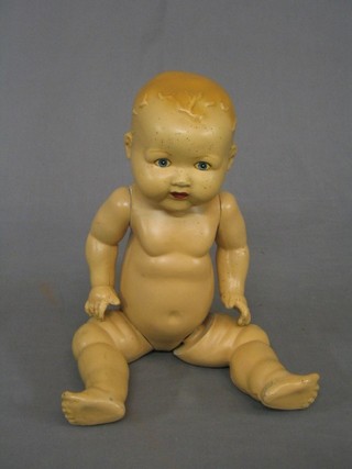 A 1930's baby doll with articulated limbs
