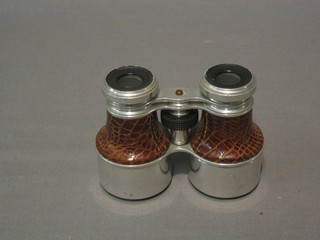 A brass monocular by Goerz of Berlin together with a small pair of binoculars