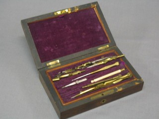A 19th Century part geometry set contained in a rosewood case