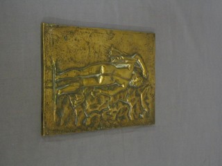A brass plaque in the form of a standing naked lady 9" x 7"