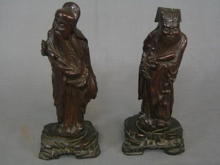 A pair of carved Eastern figures of Deitys 9 1/2"