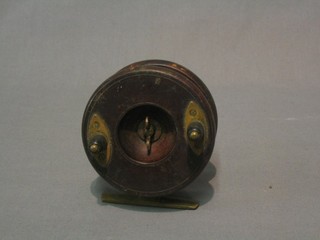 A wooden and brass centre pin fishing reel 3"