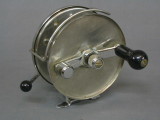 A chrome centre pin fishing reel by Alcocks 6"