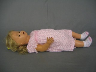 A composition headed doll with open and shutting eyes and open mouth