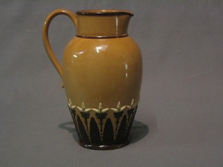 A brown glazed Doulton Lambeth jug, the base impressed Doulton Lambeth 1496 M, (base restored) 9"