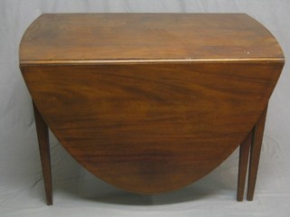 A Georgian inlaid mahogany oval drop flap gateleg dining table fitted a drawer, raised on square tapering supports 44"