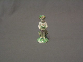A 19th Century porcelain figure of a standing cherub 4" 