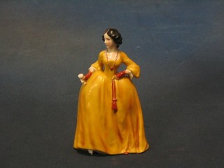 A Goebal? porcelain figure of a standing lady in a yellow ball gown with glass in hand (foot f) 6"