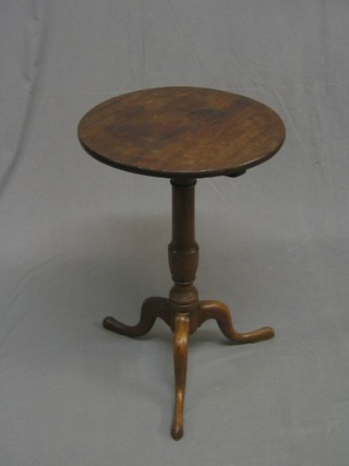 A 19th Century circular snap top mahogany wine table, raised on a gun barrel and tripod supports 18"