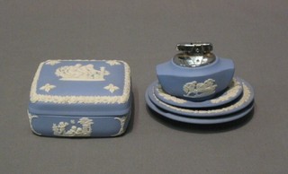 A square Wedgwood blue Jasperware trinket box and cover 4", a circular Wedgwood dish decorated William Shakespeare, 2 do. ashtrays and a table lighter