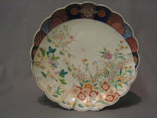 A 19th Century Japanese Imari porcelain plate with lobed border decorated landscape, the reverse with seal mark 12"