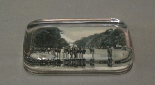 A rectangular glass paperweight the back decorated a black and white photograph of Carriage Drive at Rotton Row? and another Seaside Resort