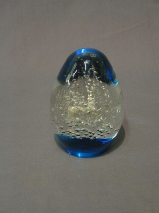 A large dome shaped blue glass paperweight 5"