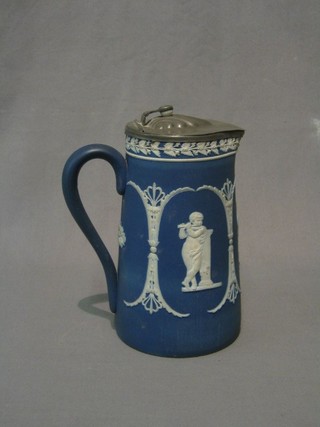 A Wedgwood style blue Jasperware jug with pewter mounts the base marked W, 7"