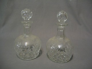 A pair of cut glass club shaped decanters