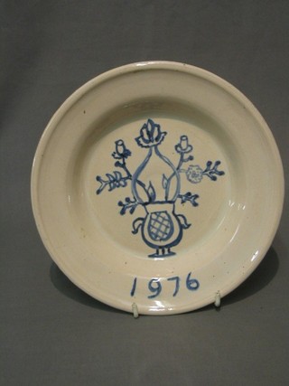A Delft style soup plate the base incised LR, dated 1976, 9"