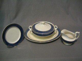 A Leighton Rio pattern dinner service with blue and gilt banding