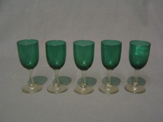 5 green glass wine glasses with clear glass stems