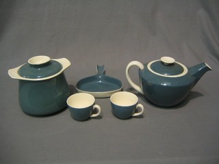 A 12 piece Poole pottery blue glazed tea service with teapot, twin handled biscuit barrel, 5 circular bowls, tea strainer stand, 3 cups and 3 saucers