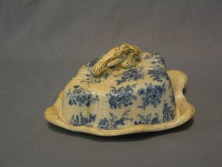 A Victorian blue and white pottery cheese dish and cover 12"