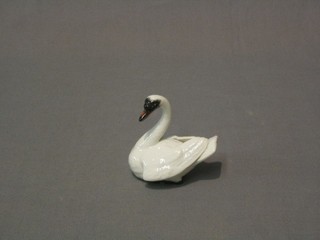 A "Meissen" figure of a swimming swan 2"