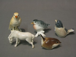 A Keranik figure of a seated bird, 3 other figures of birds and a standing horse