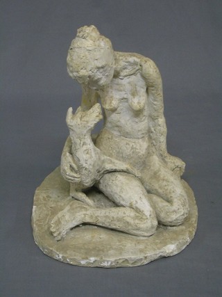A plaster figure of a seated naked lady and dog 13"