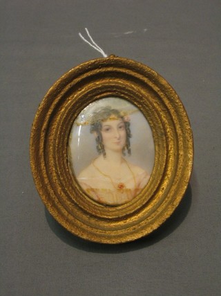A Victorian oval miniature portrait on ivory of a lady wearing a peach coloured dress 2 1/2"