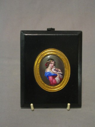 An oval enamelled portrait miniature "Lady with Bird" 2" oval