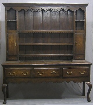 An 18th Century oak dresser, the raised panelled back with moulded cornice and pierced and wavy apron, fitted shelves flanked by a pair of cupboards above 2 short drawers, the base fitted 3 long drawers raised on cabriole supports (some old and treated wood worm) 72"