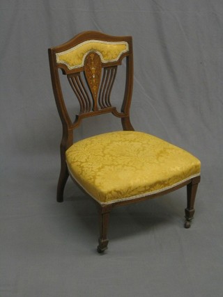 A Victorian inlaid rosewood bedroom chair, raised on square tapering supports