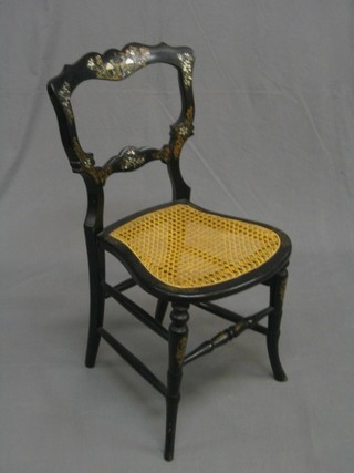 A Victorian black lacquered and inlaid mother of pearl balloon back bedroom chair, with shaped mid rail and woven cane seat