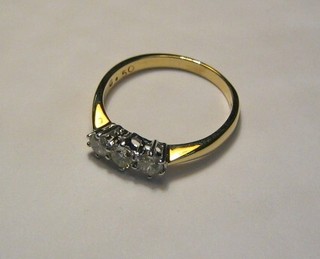 A lady's 18ct gold engagement/ dress ring set 3 diamonds (approx 1/2ct)