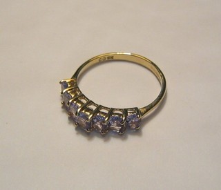 A lady's 9ct gold dress ring set 7 graduated Tanzanite