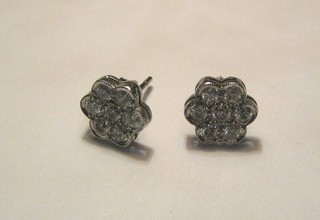 A pair of lady's cluster ear studs set 6 diamonds