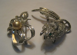 A silver "filigree" brooch in the form of a fish and 1 other in the form of a ribbon