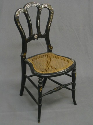 A Victorian black lacquered and inlaid mother of pearl Admiralty/tulip back bedroom chair with woven cane seat