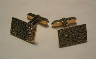 A pair of gentleman's 9ct barked gold cufflinks
