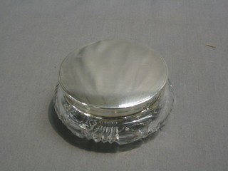 A circular cut glass powder bowl with silver lid and engine turned decoration, London 1939 by Mappin & Webb, 4"