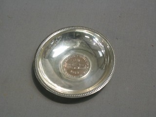 A South African circular silver dish set a 1960 5 cent piece 4"