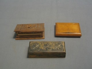 2 carved wooden stamp cases and a small wooden box