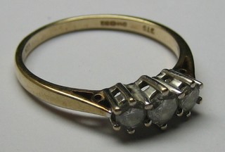 A lady's gold dress ring set 3 diamonds