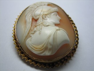 A lady's shell carved cameo portrait brooch in the form of a warrior contained in a gilt metal mount