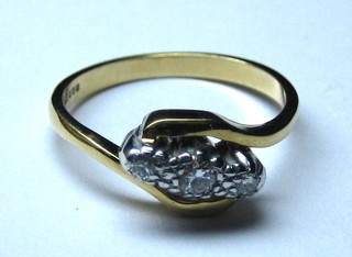 A lady's 18ct gold dress ring set 3 illusion set diamonds