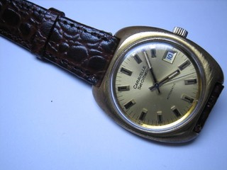 A gentleman's automatic wristwatch by Bulova contained in a gold plated case, complete with instructions