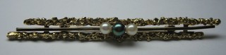 A 9ct gold bar brooch set 1 black pearl  and 2 white pearls