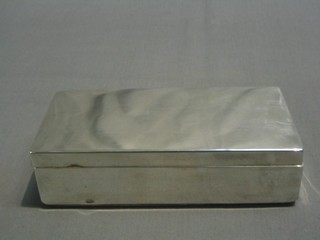 A plain Victorian silver cigarette box with hinged lid, London 1886 7"