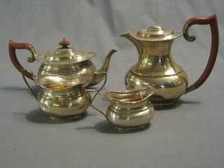 A 4 piece silver tea service comprising teapot, cushion shaped hotwater jug, sugar bowl and twin handled cream jug, Birmingham 1970, 39 ozs